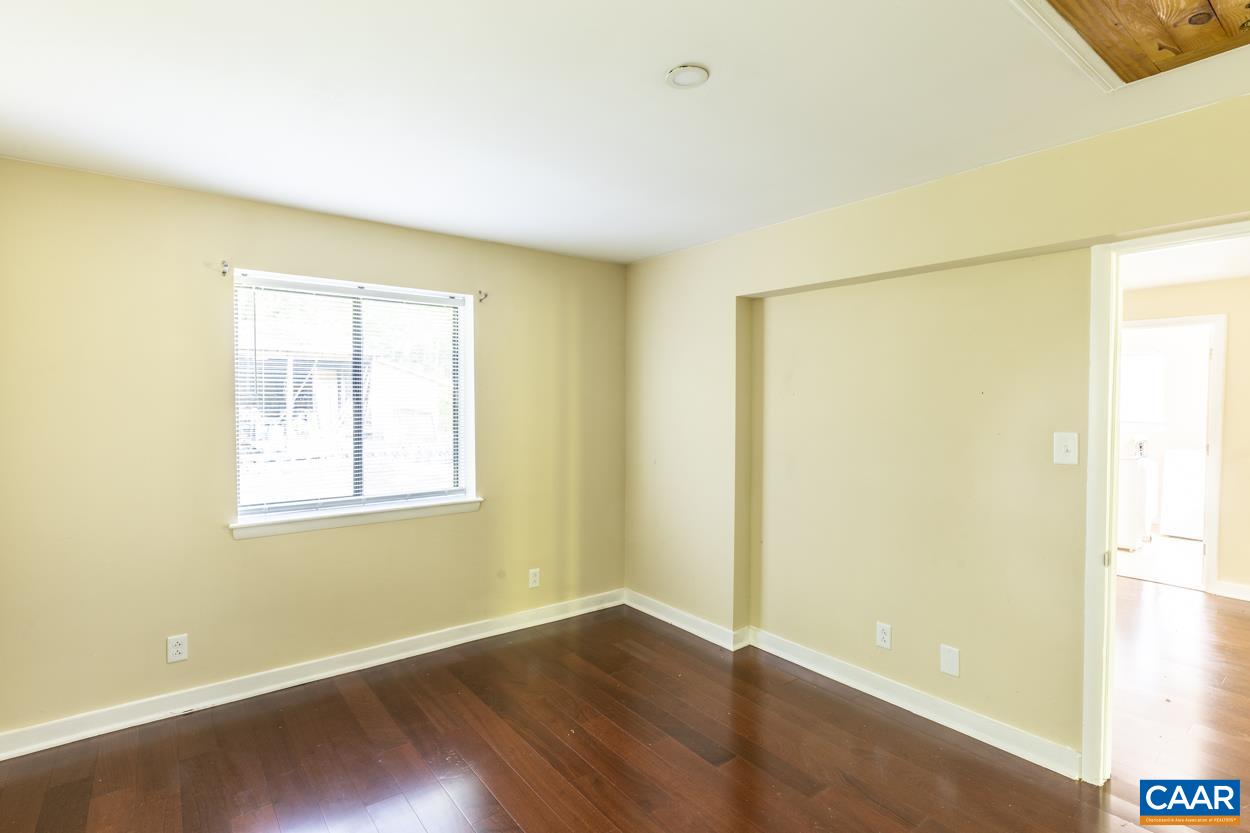1118 Wolf Trap Road Charlottesville, VA 22911 - Photo 53 of 64 an empty room with wooden floor and a window