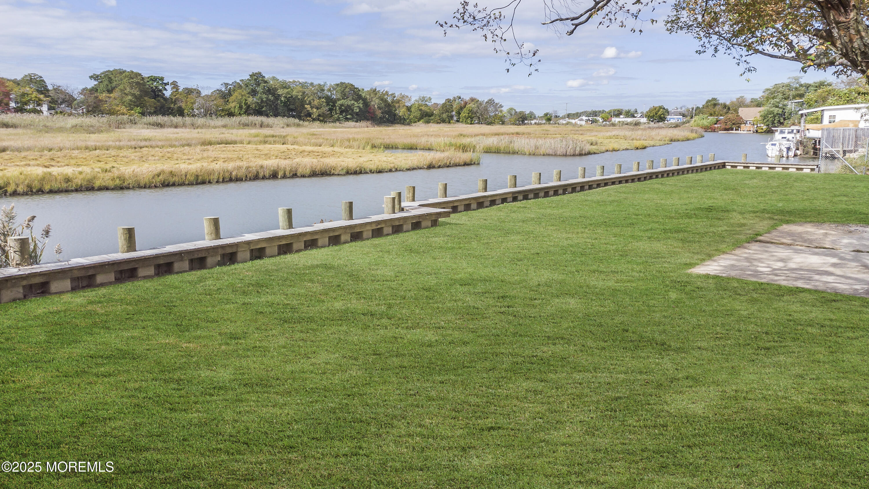 103 Creek Road Keansburg, NJ 07734 - Photo 1 of 34 a view of a lake with houses in the back