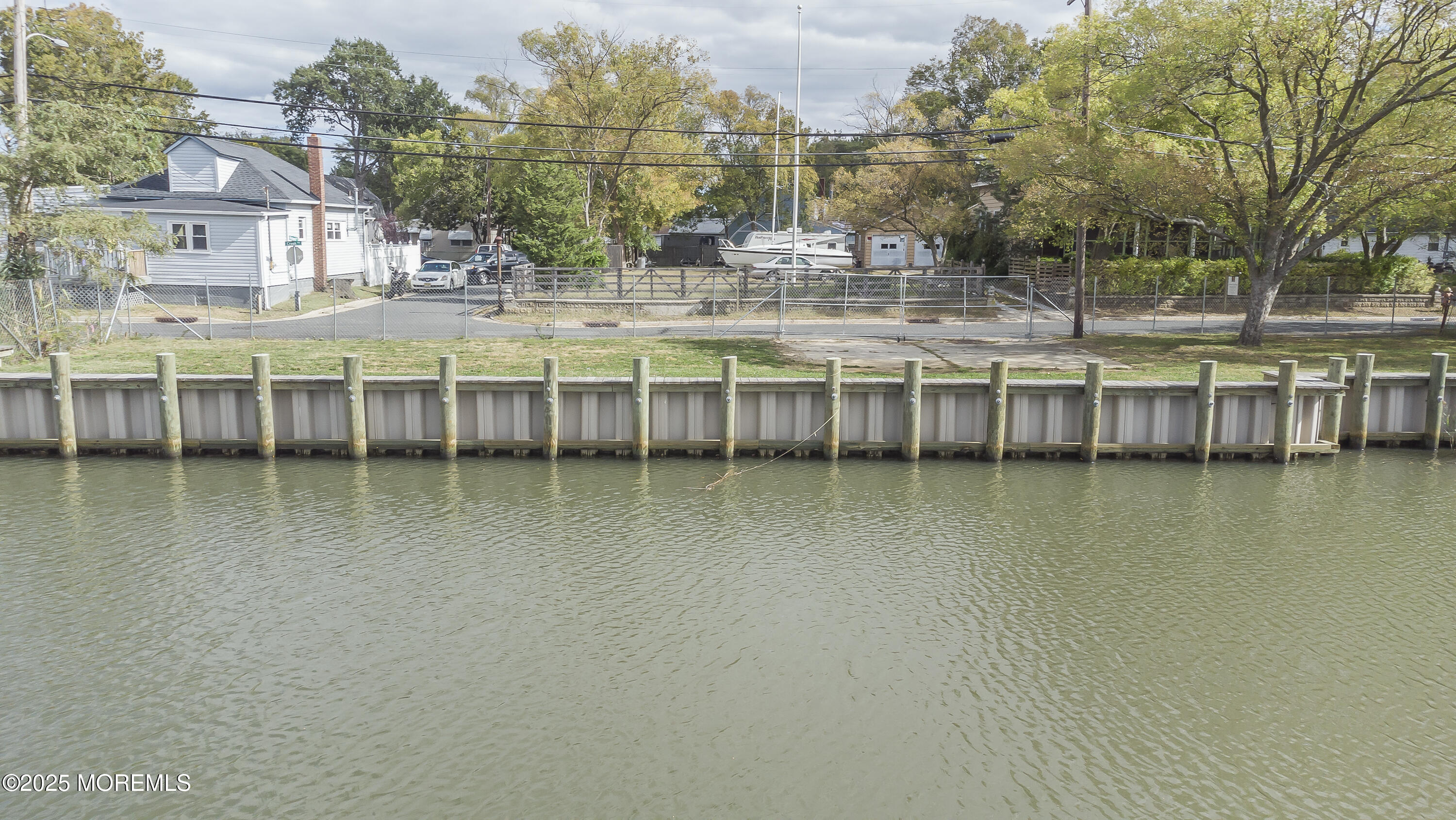 103 Creek Road Keansburg, NJ 07734 - Photo 8 of 34 a view of a lake with building in front of it
