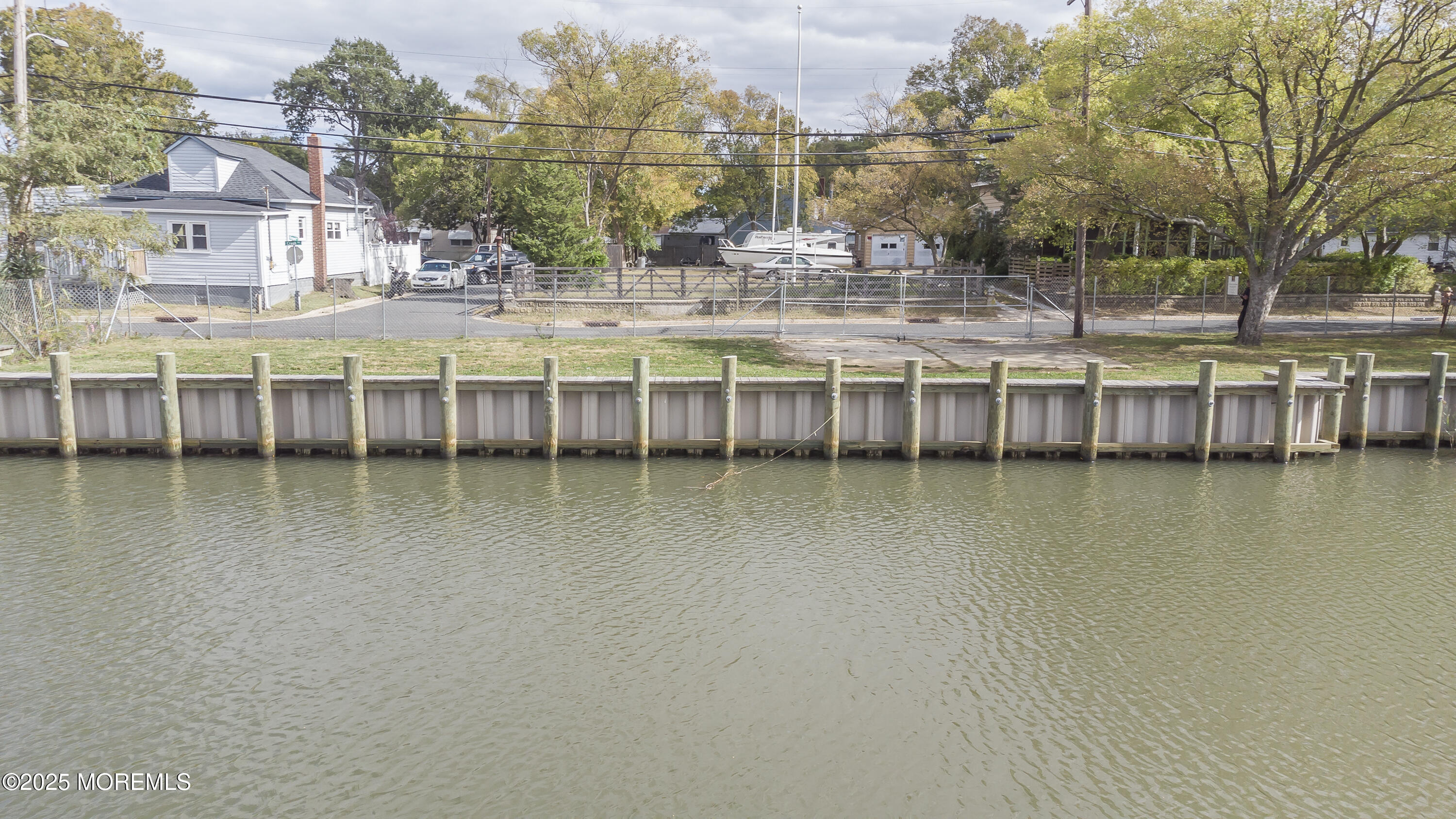 103 Creek Road Keansburg, NJ 07734 - Photo 9 of 34 a view of a lake with building in front of it