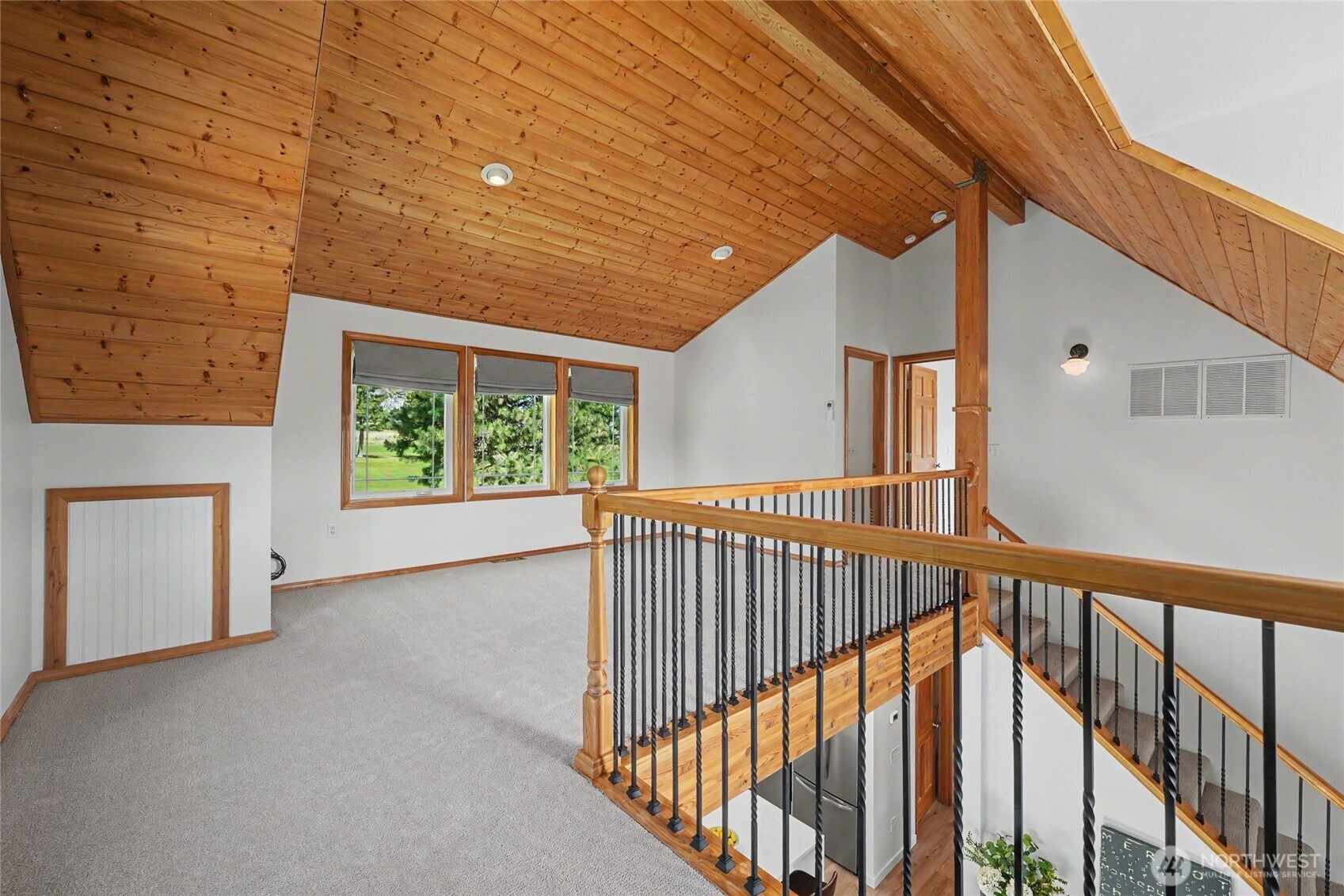 93 Golf Course Drive Pateros, WA 98846 - Photo 17 of 34 a view of a hallway with wooden floor and stairs