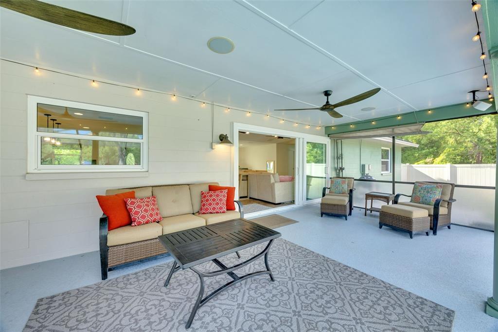 3535 Moores Lake Road Dover, FL 33527 - Photo 43 of 85 Huge, covered back porch with two ceiling fans. The 2 Bose speakers and the hanging lights will stay.