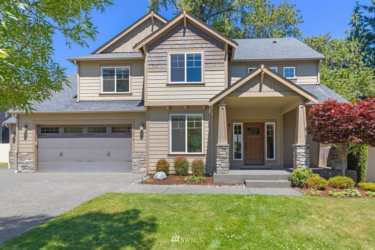 5014 Northeast 24th Street Renton, WA 98059 - Photo 1 of 37 a front view of a house with a yard and porch