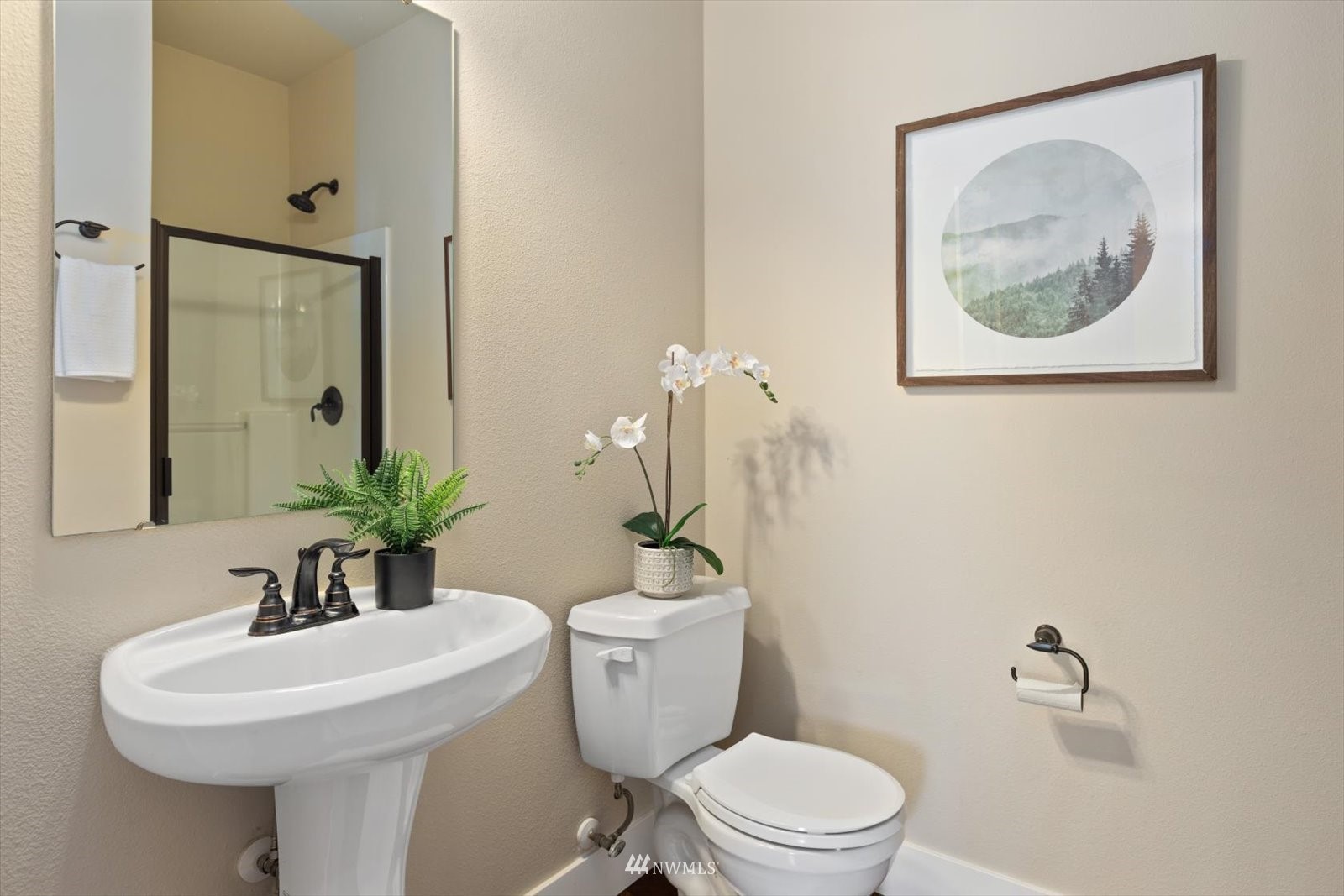 5014 Northeast 24th Street Renton, WA 98059 - Photo 19 of 37 a bathroom with a toilet a sink and mirror