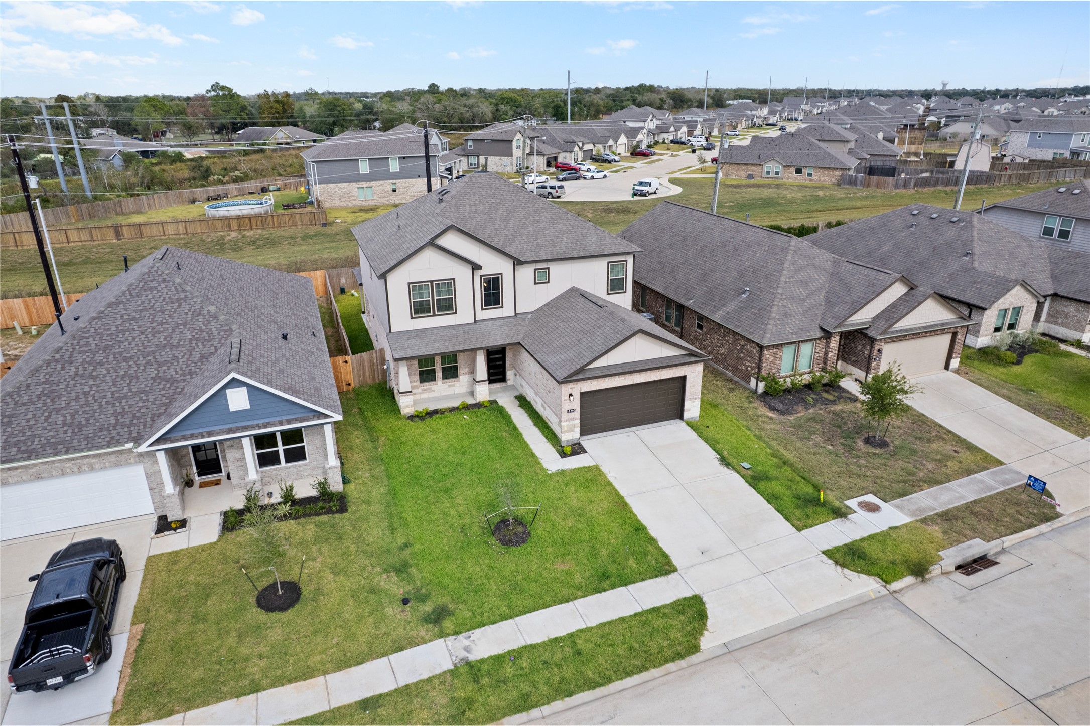 8322 Amethyst Valley Lane Angleton, TX 77515 - Photo 14 of 39 an aerial view of a house with garden space and street view