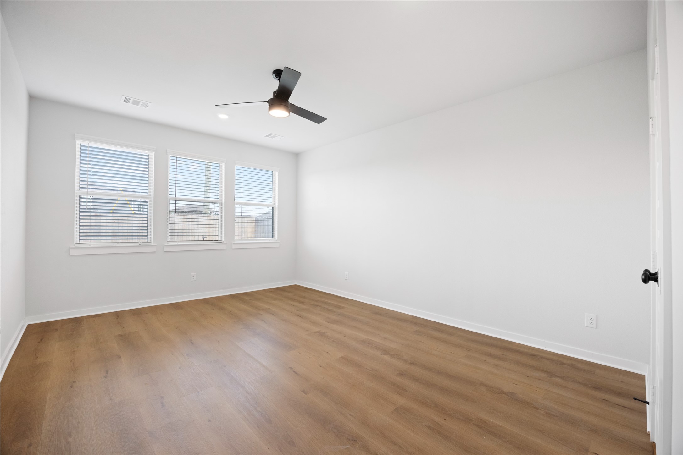 8322 Amethyst Valley Lane Angleton, TX 77515 - Photo 26 of 39 wooden floor in an empty room with a window