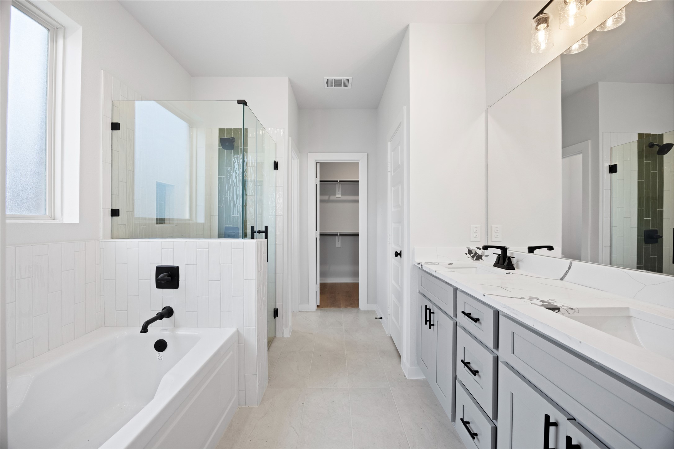 8322 Amethyst Valley Lane Angleton, TX 77515 - Photo 28 of 39 a bathroom with a tub sink and mirror