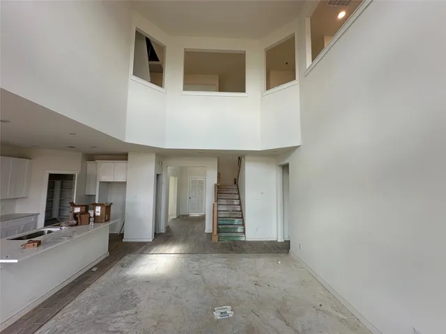 a view of a livingroom with furniture and an empty room