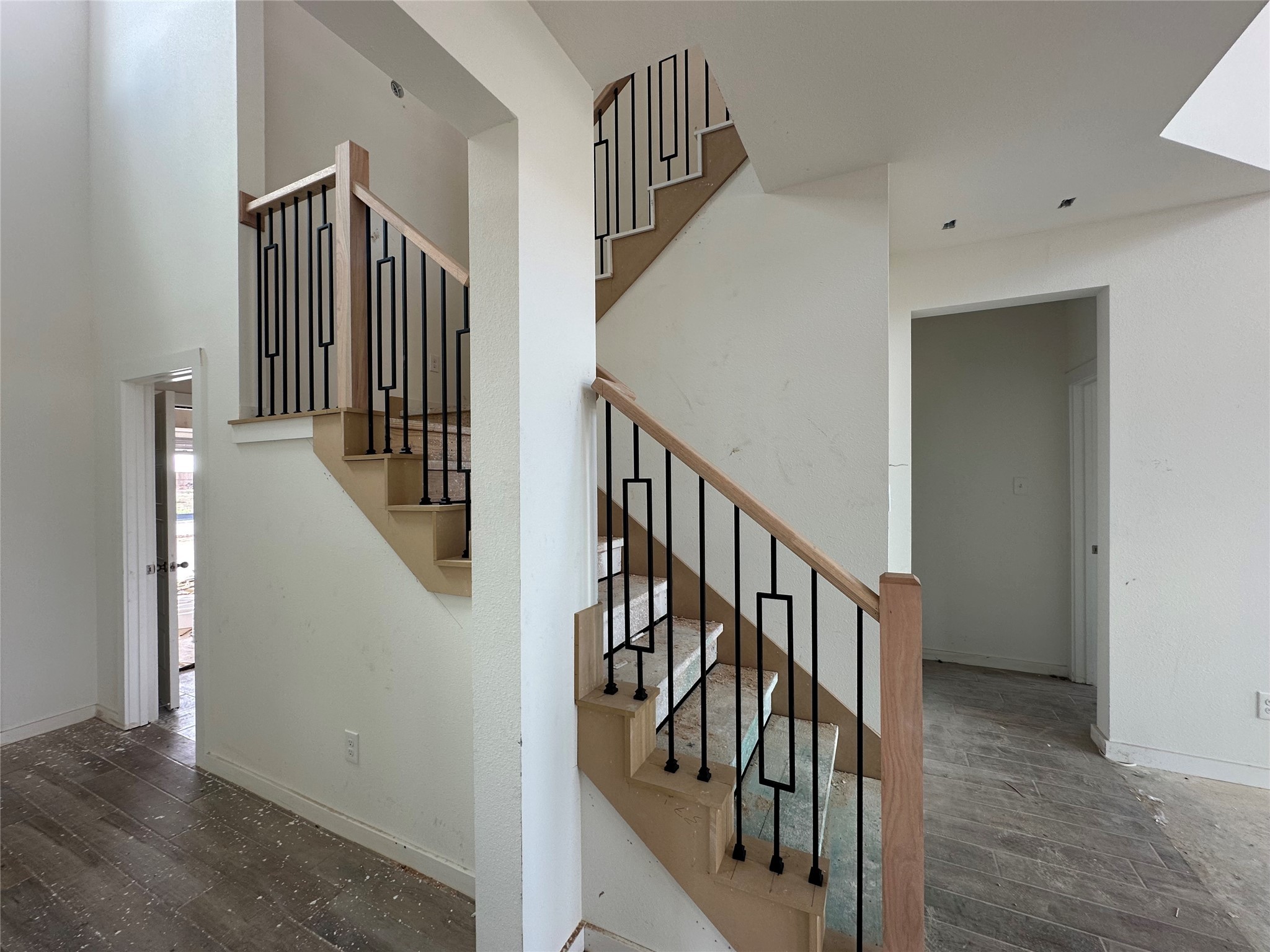 8322 Amethyst Valley Lane Angleton, TX 77515 - Photo 7 of 39 a view of staircase with lots of frames on wall and wooden floor
