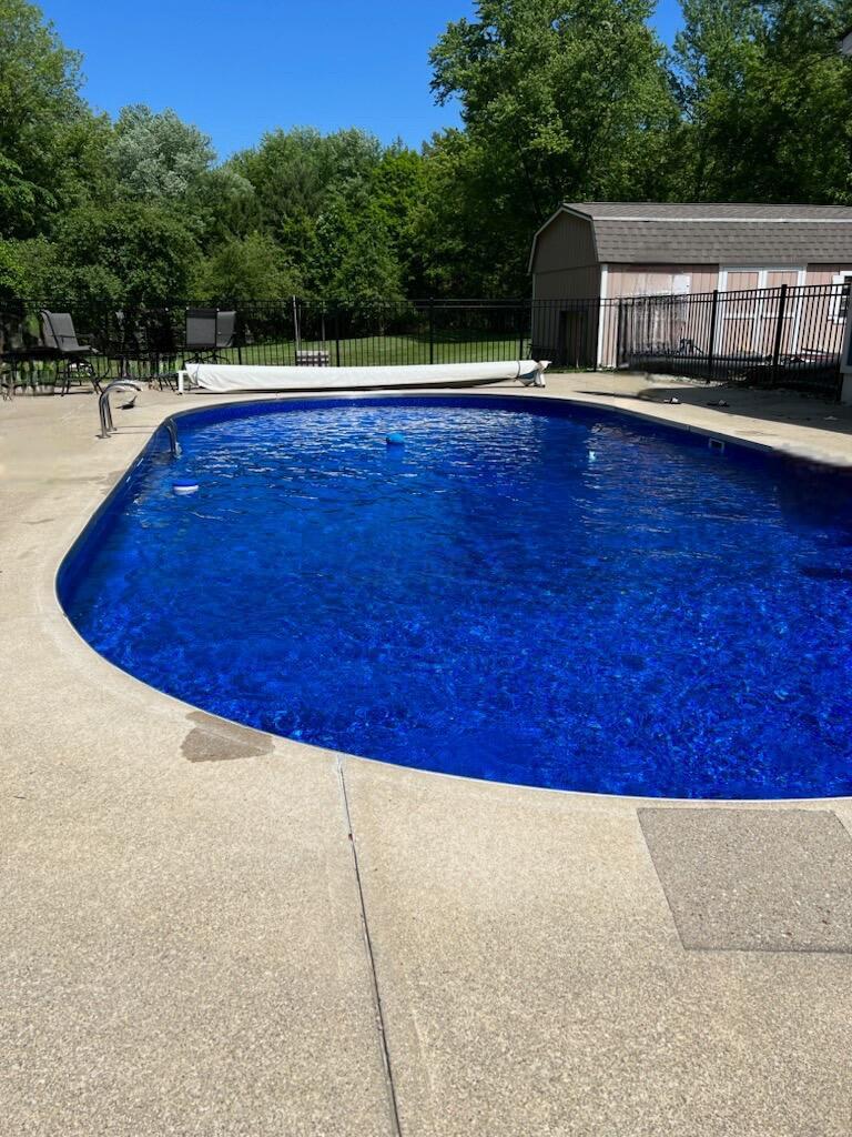 7790 Schott Road Westerville, OH 43081 - Photo 41 of 50 Beautiful NEW pool liner, rod iron railing fence, concrete surround....ALL ready for Summer 2023 (photo taken last Summer)!