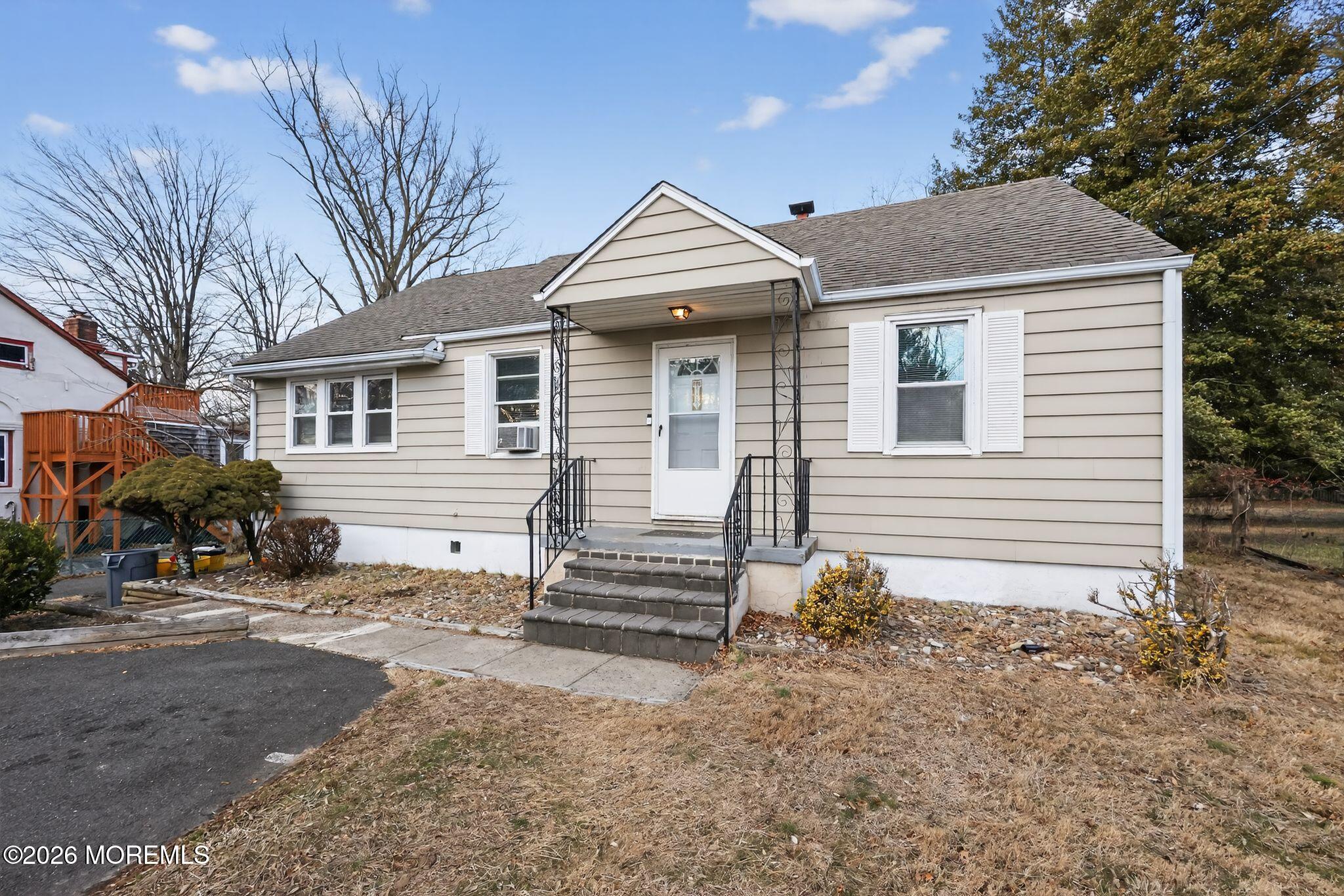 438 Ewingville Road Ewing, NJ 08638 - Photo 15 of 44 a front view of a house with a yard