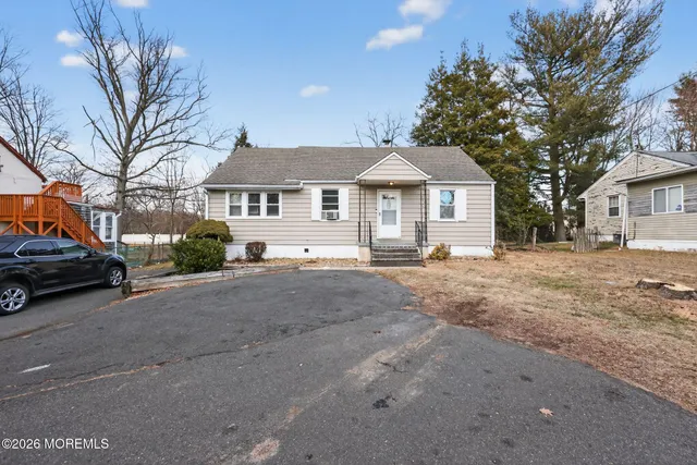 a view of a car park in front of a house