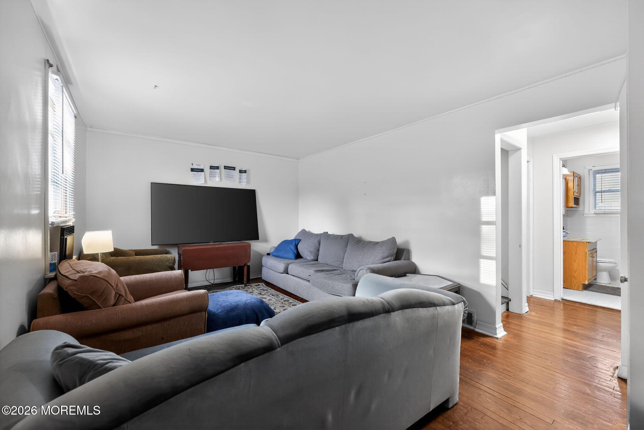 438 Ewingville Road Ewing, NJ 08638 - Photo 22 of 44 a living room with furniture and a flat screen tv