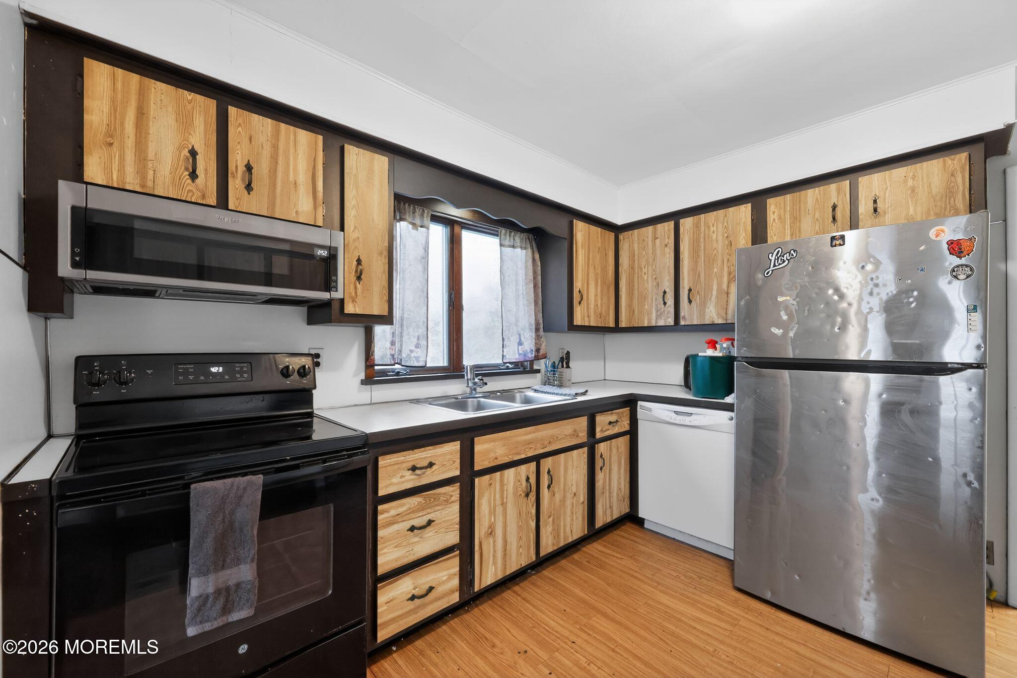 438 Ewingville Road Ewing, NJ 08638 - Photo 25 of 44 a kitchen with stainless steel appliances granite countertop a refrigerator a stove a sink and a microwave