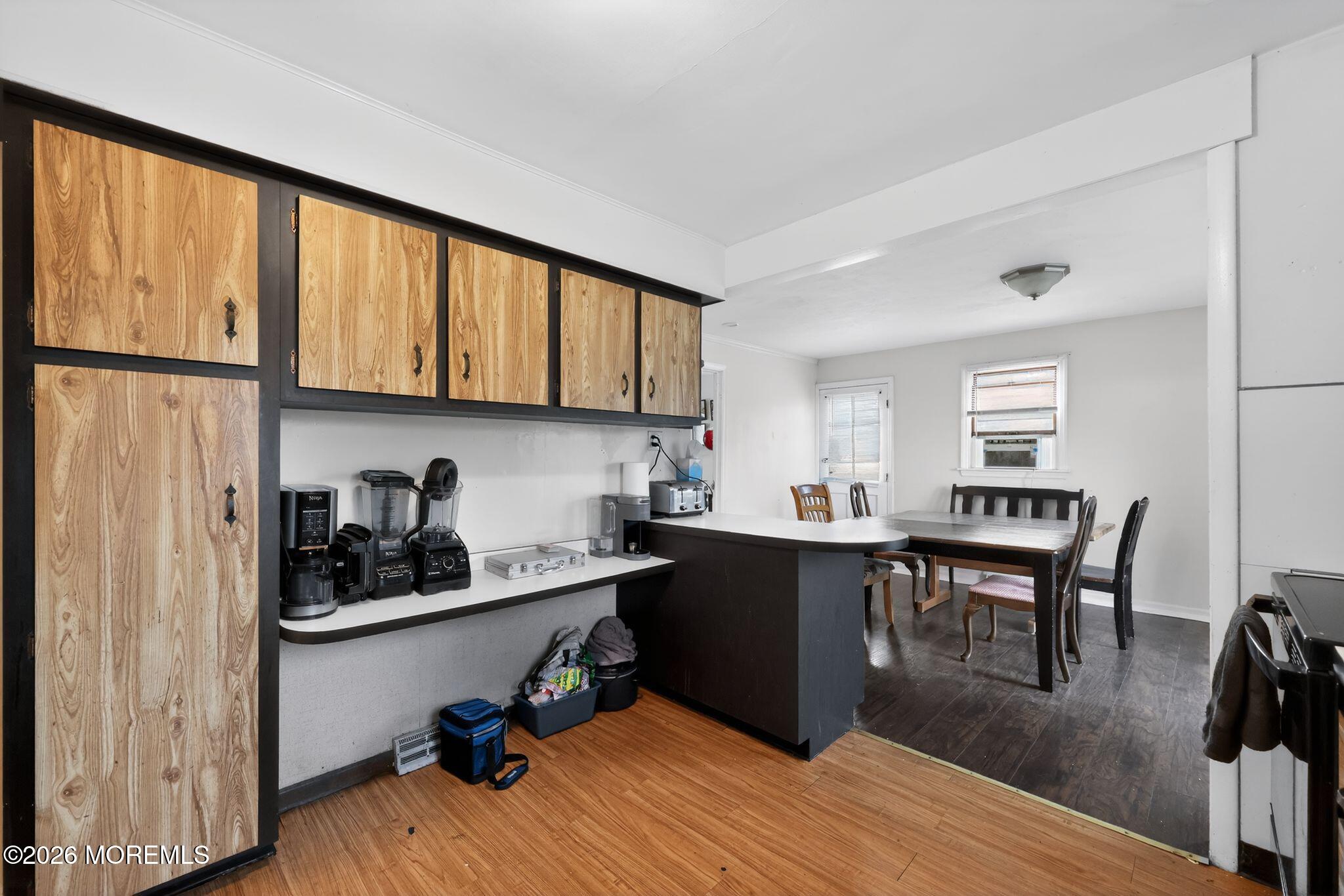 438 Ewingville Road Ewing, NJ 08638 - Photo 26 of 44 a view of a workspace with furniture and wooden floor
