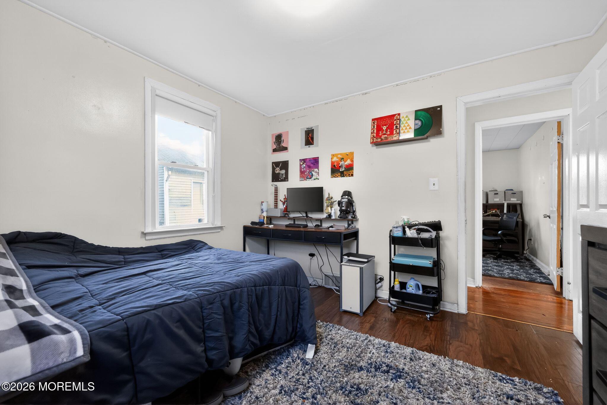 438 Ewingville Road Ewing, NJ 08638 - Photo 31 of 44 a bedroom with a bed and a table in it