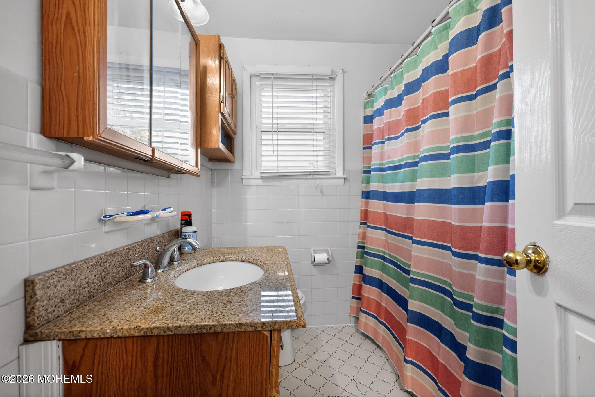 438 Ewingville Road Ewing, NJ 08638 - Photo 40 of 44 a bathroom with a sink and a mirror