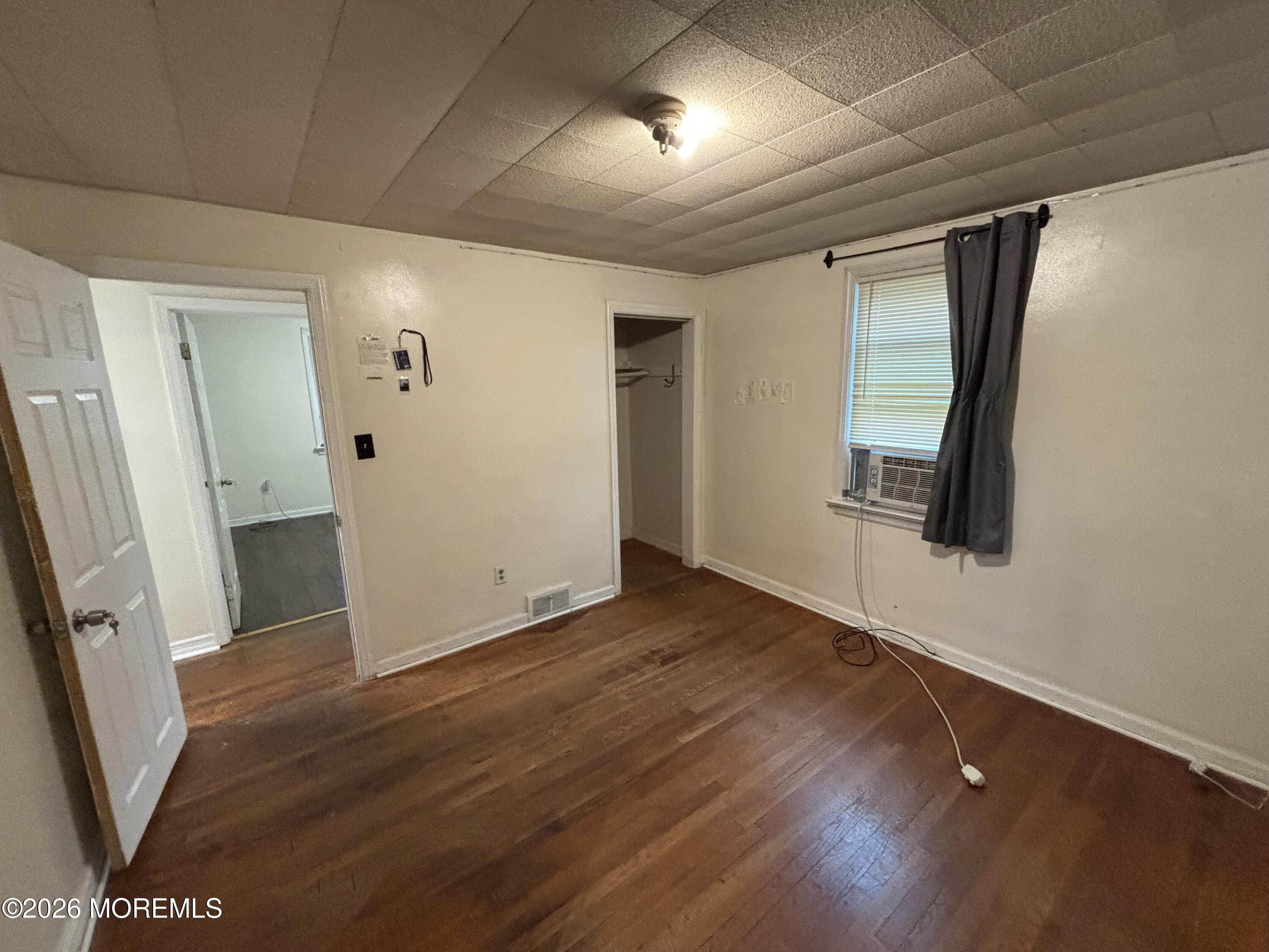 438 Ewingville Road Ewing, NJ 08638 - Photo 6 of 44 an empty room with wooden floor and windows