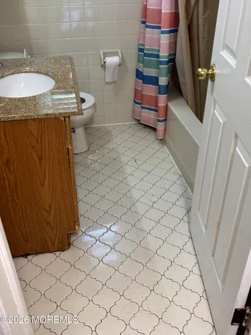 a bathroom with a sink and toilet