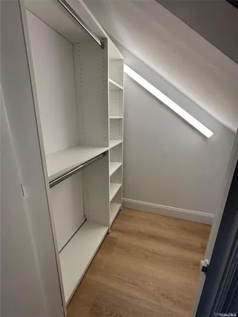a view of an empty walk in closet