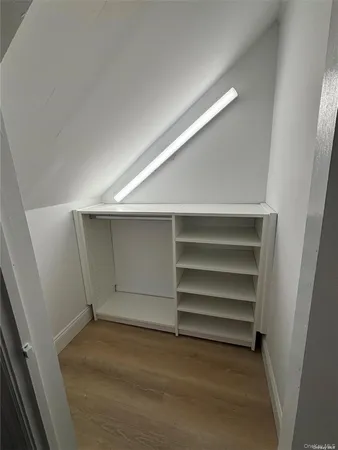 a view of an empty walk in closet