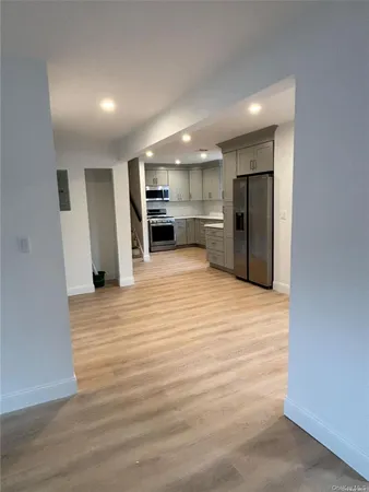 a view of a kitchen with wooden floor