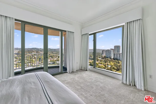 a view of an empty room and a window with outer view
