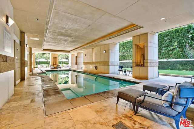 a view of a patio with swimming pool table and chairs