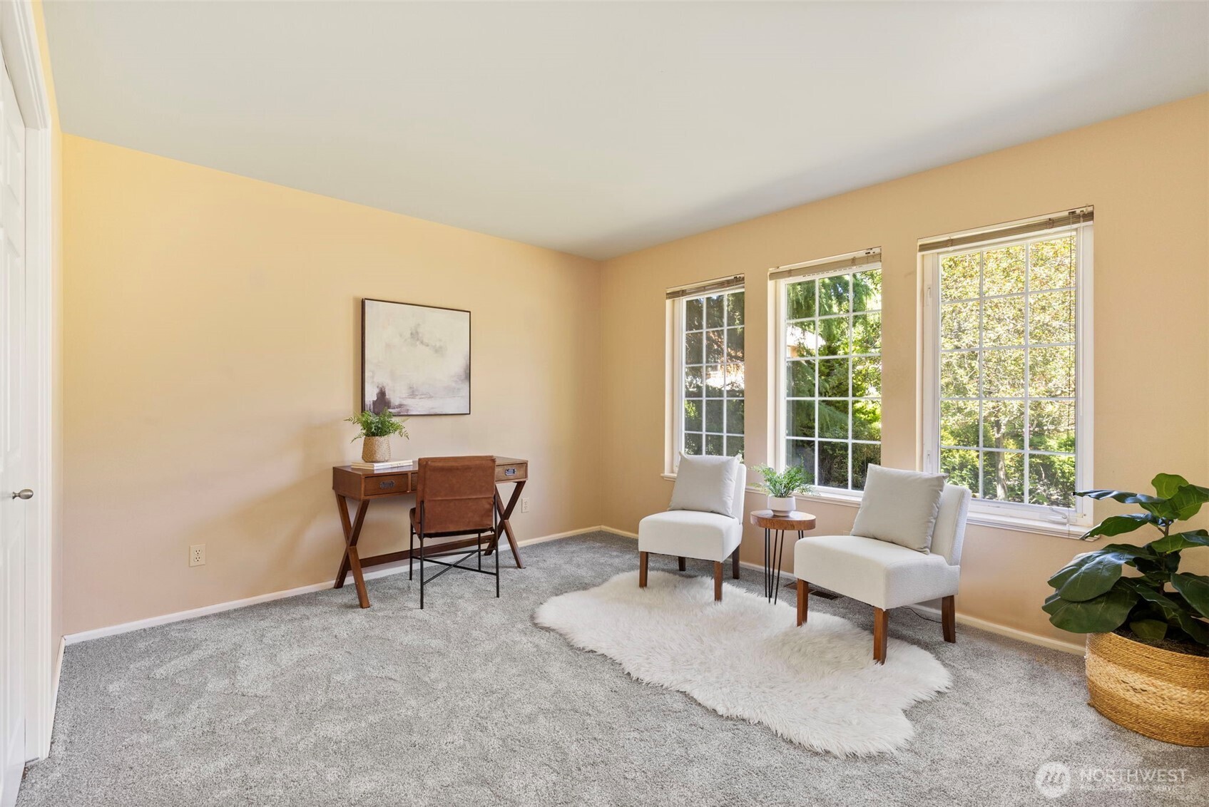1757 Maple Street Port Townsend, WA 98368 - Photo 22 of 40 a living room with furniture and a potted plant next to a window