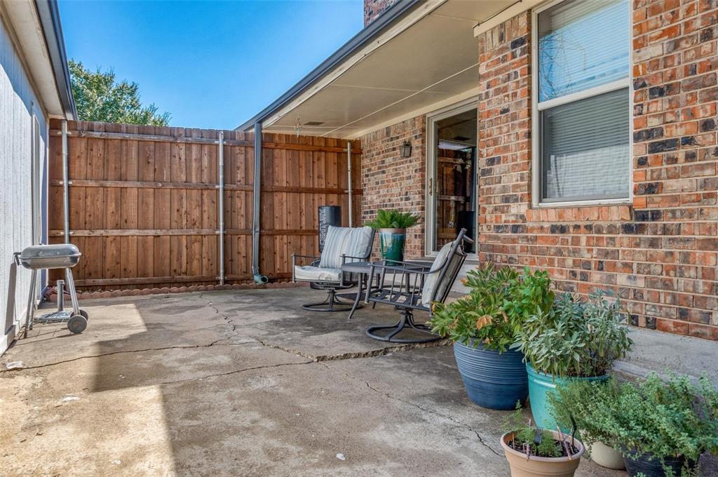 7739 Dentcrest Drive Dallas, TX 75254 - Photo 23 of 23 a view of a backyard with sitting area and potted plants