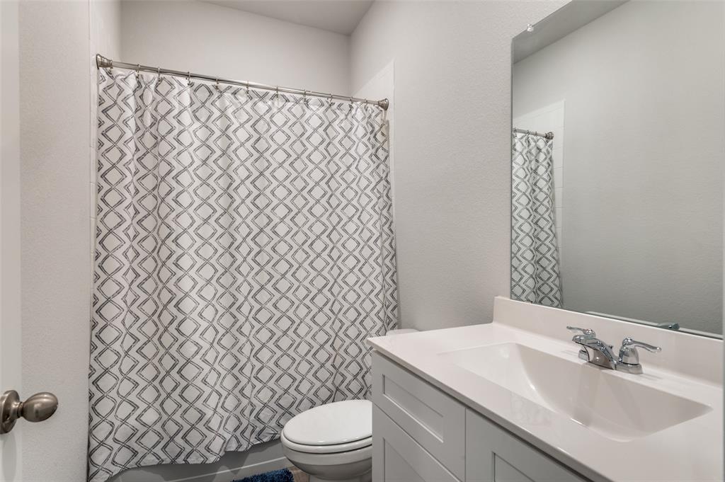 9628 Austin Holw Road Fort Worth, TX 76036 - Photo 26 of 37 a bathroom with a sink toilet and shower