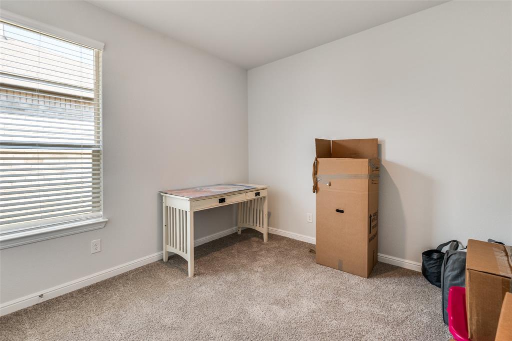 9628 Austin Holw Road Fort Worth, TX 76036 - Photo 27 of 37 a room with furniture and a window