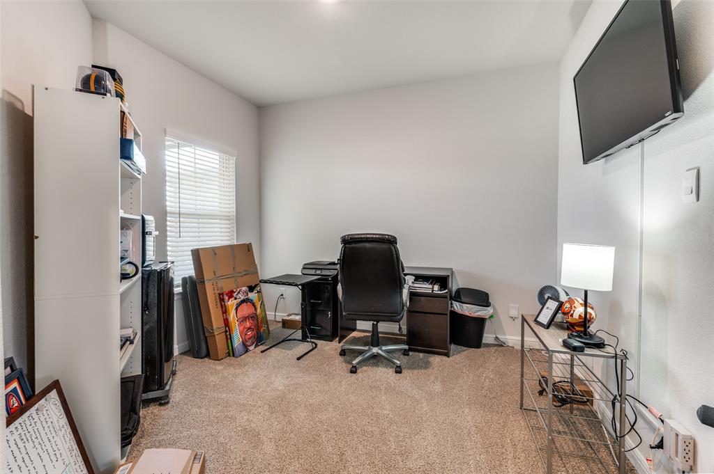 9628 Austin Holw Road Fort Worth, TX 76036 - Photo 6 of 37 a view of a workspace with furniture and a window
