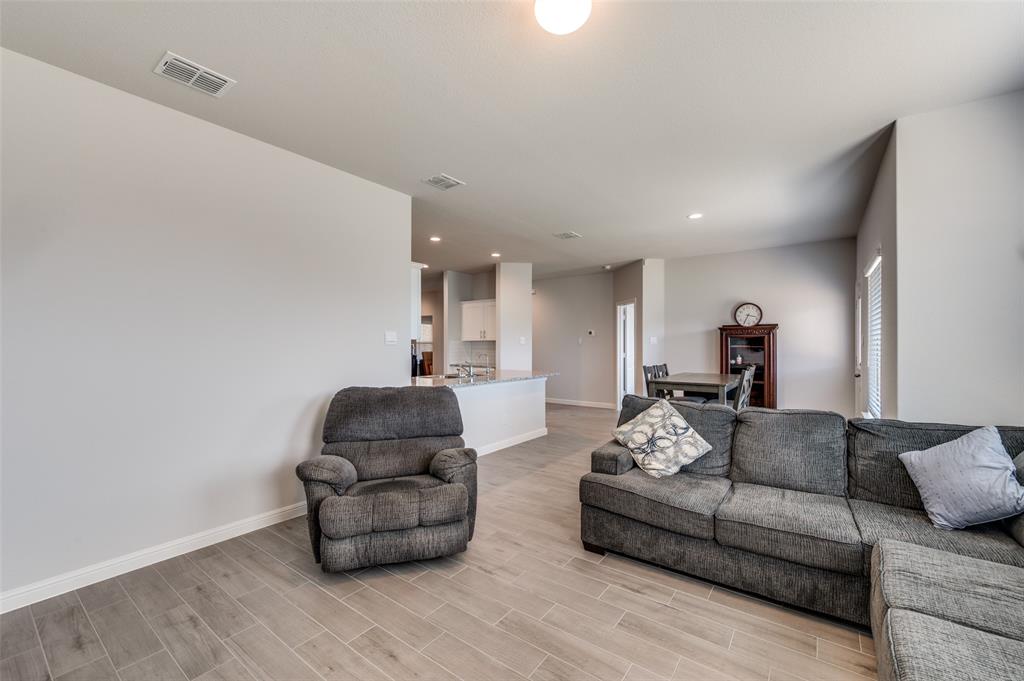 9628 Austin Holw Road Fort Worth, TX 76036 - Photo 9 of 37 a living room with furniture and a wooden floor