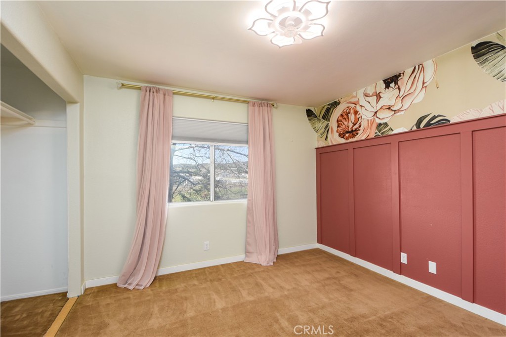 40520 Lake Riverside Drive Aguanga, CA 92536 - Photo 13 of 36 a view of an empty room and window
