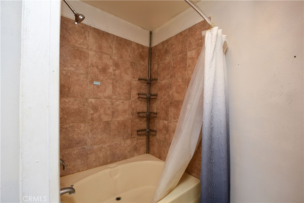 40520 Lake Riverside Drive Aguanga, CA 92536 - Photo 19 of 36 a bathroom with a shower and a tub