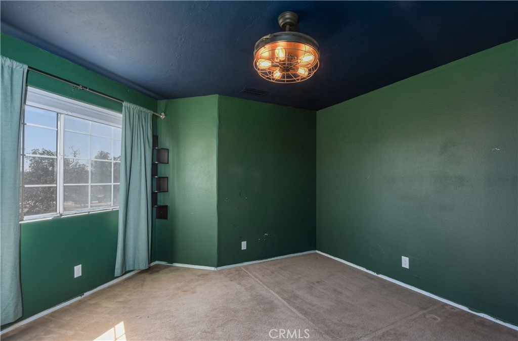 40520 Lake Riverside Drive Aguanga, CA 92536 - Photo 20 of 36 an empty room with a window and a mirror