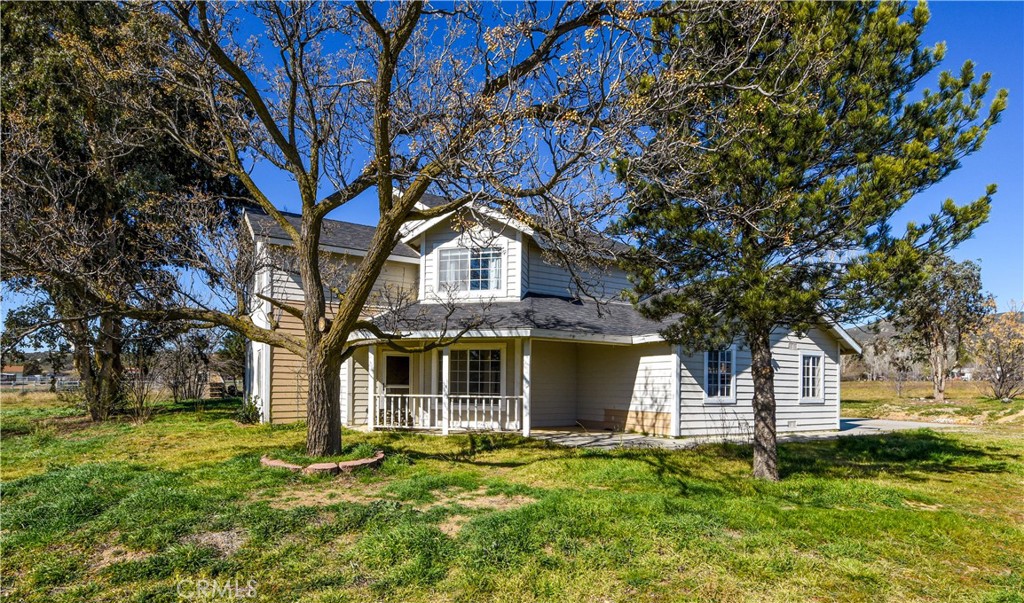 40520 Lake Riverside Drive Aguanga, CA 92536 - Photo 2 of 36 a front view of a house with a garden