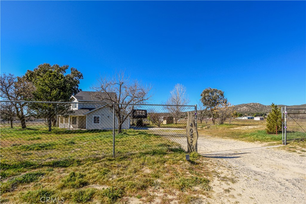 40520 Lake Riverside Drive Aguanga, CA 92536 - Photo 24 of 36 a view of a house with a yard