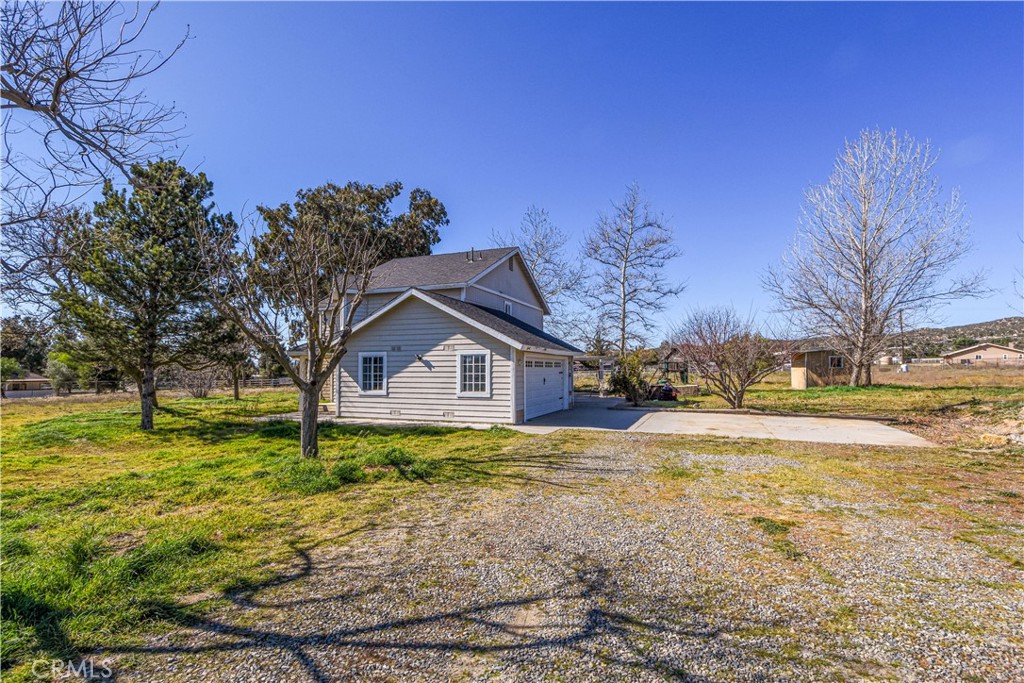 40520 Lake Riverside Drive Aguanga, CA 92536 - Photo 25 of 36 a house view with a garden space