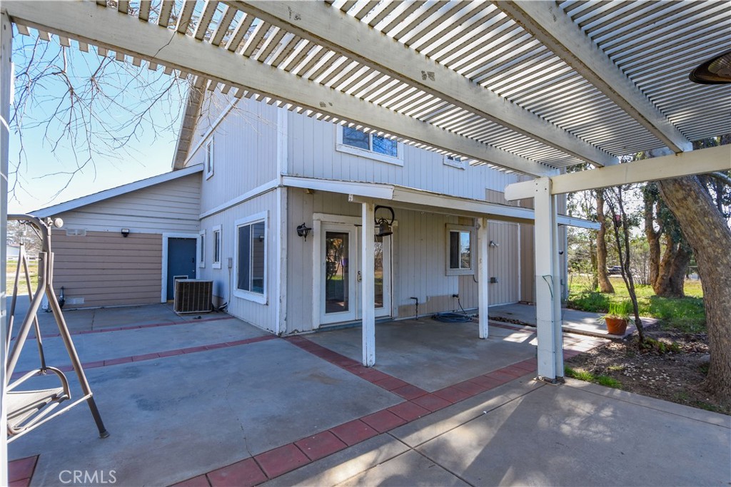 40520 Lake Riverside Drive Aguanga, CA 92536 - Photo 29 of 36 a view of a house with porch and wooden floor