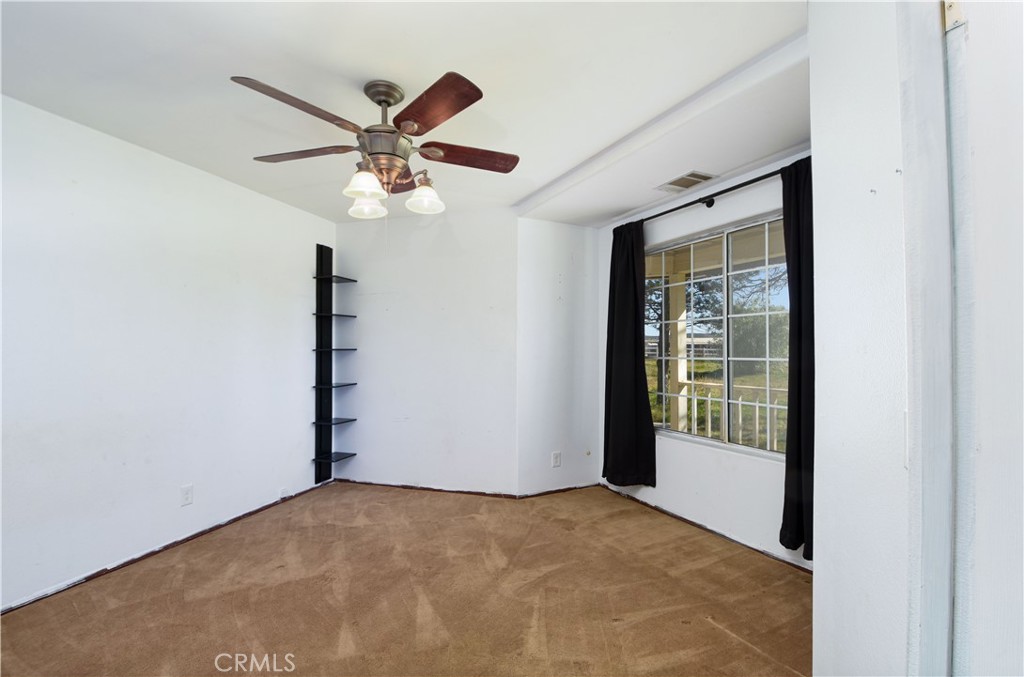 40520 Lake Riverside Drive Aguanga, CA 92536 - Photo 7 of 36 a view of an empty room with a window