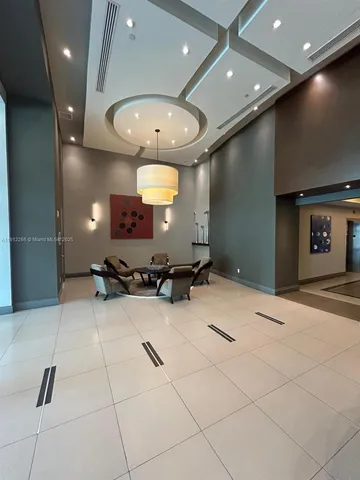 a large room with a large mirror and furniture