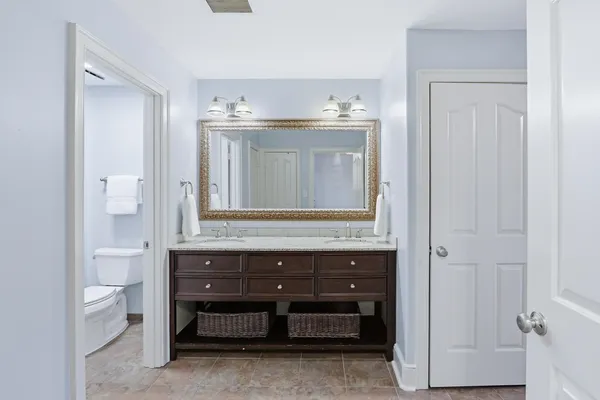 a view of room with a sink and a mirror