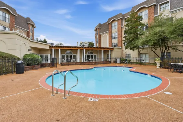 a view of a swimming pool with a lounge chairs