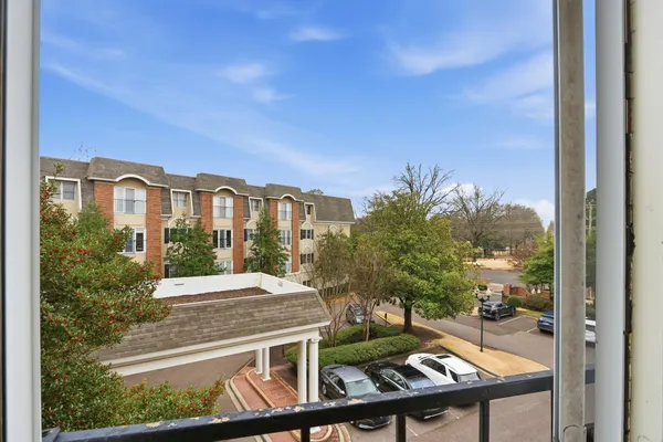 a view of a balcony with chairs