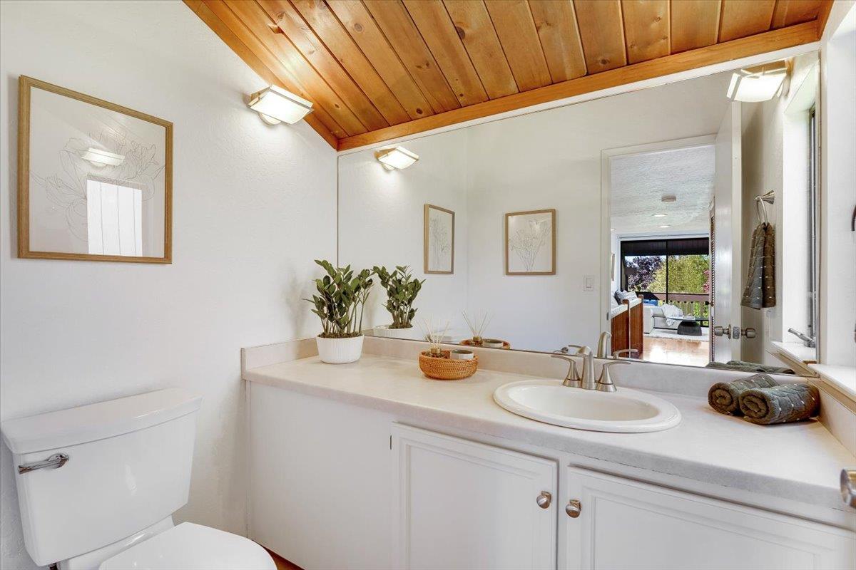 113 Tree Frog Lane Santa Cruz, CA 95060 - Photo 16 of 49 a bathroom with a sink and a mirror