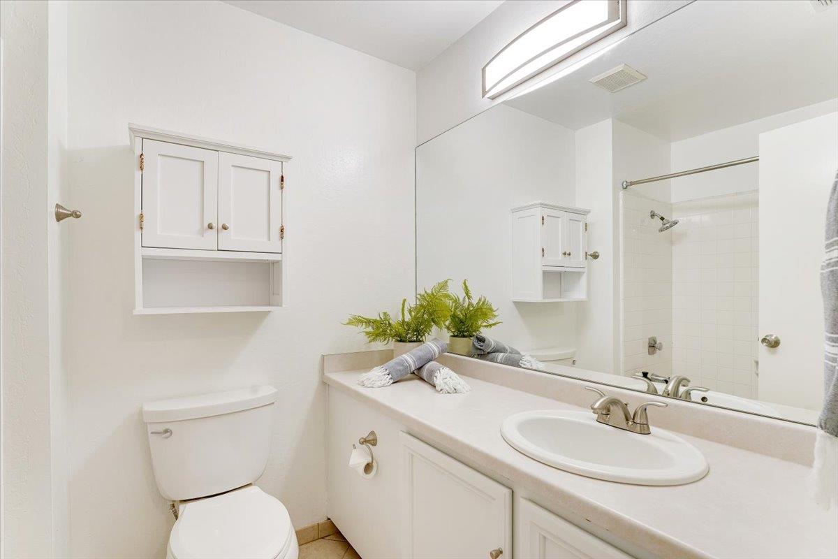 113 Tree Frog Lane Santa Cruz, CA 95060 - Photo 18 of 49 a bathroom with a granite countertop toilet sink and mirror