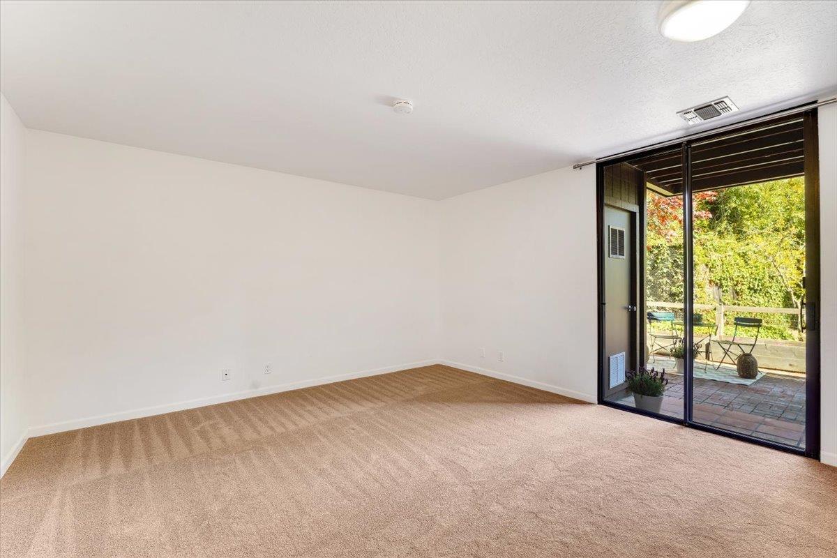 113 Tree Frog Lane Santa Cruz, CA 95060 - Photo 20 of 49 an empty room with large windows