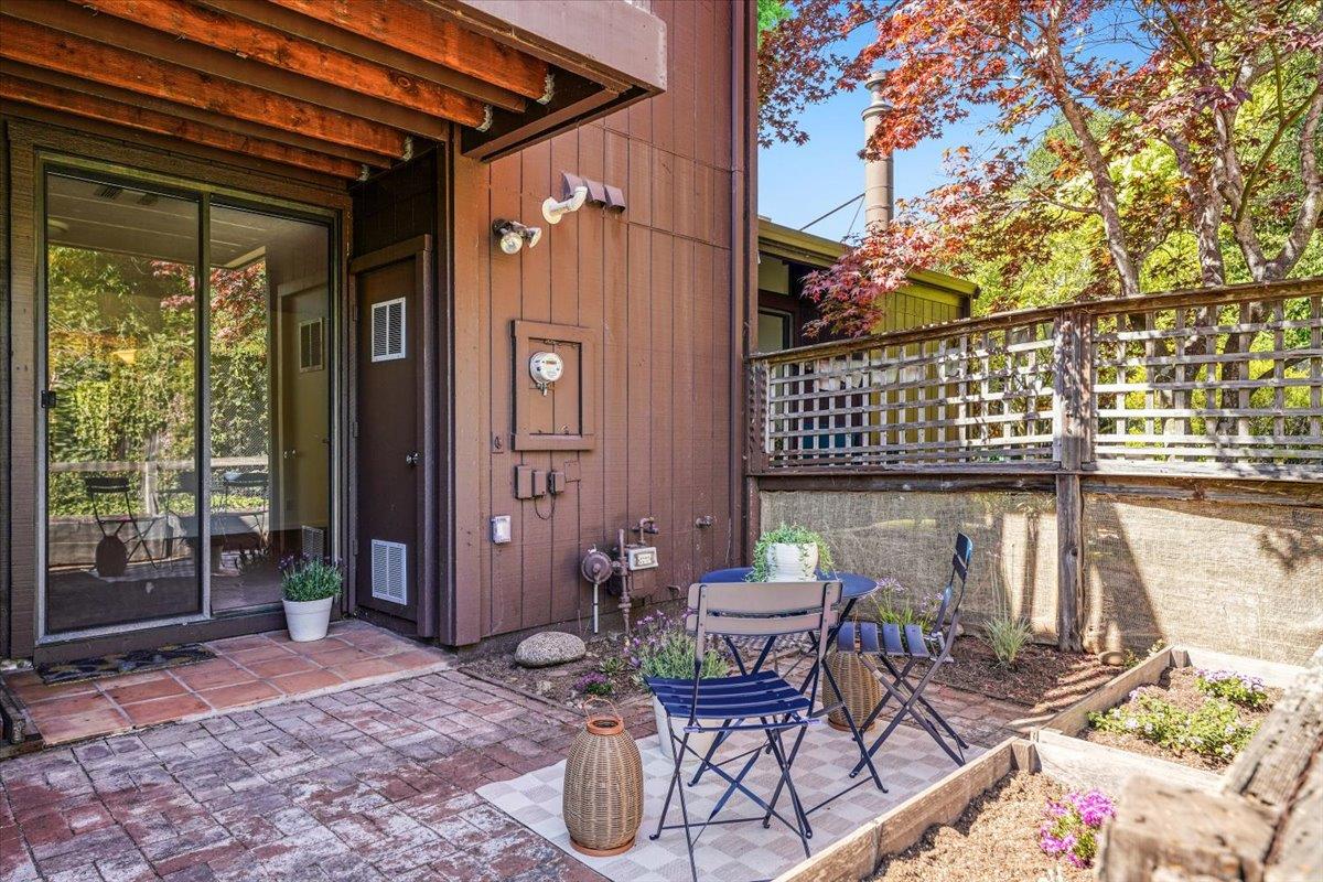 113 Tree Frog Lane Santa Cruz, CA 95060 - Photo 25 of 49 a view of a balcony with chairs and a potted plant